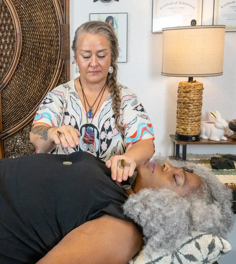 Reiki session with crystals in a warm healing room